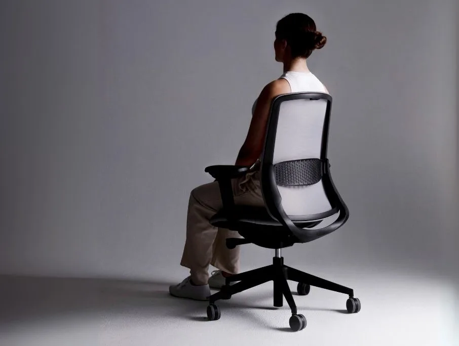 lady comfortably sitting on mesh chair