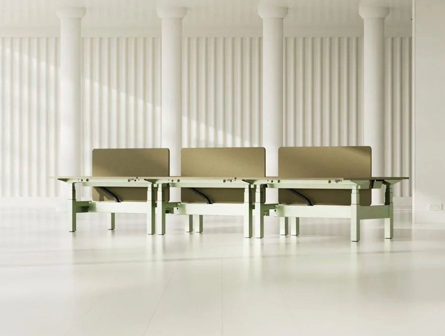 three green standing desks